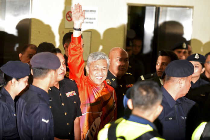 United Malays National Organization's (UMNO) Pexresident Ahmad Zahid Hamidi waves as he walks into courtroom Friday at Kuala Lumpur High Court in Kuala Lumpur, Malaysia. Photo: Yam G-Jun / Associated Press United Malays National Organization's (UMNO) Pexresident Ahmad Zahid Hamidi waves as he walks into courtroom Friday at Kuala Lumpur High Court in Kuala Lumpur, Malaysia. Photo: Yam G-Jun / Associated Press
