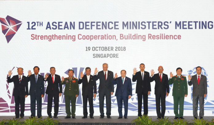 Defense Ministers from left to right, Brunei's Second Minister, Brunei, Halbi Nin Haji Mohd Yusof, Cambodia's Samdech Pichey Sena Tea Banh, Indonesia's General Ryamizard Ryacudu, Laos' Lieutenant-General Chansamone Chanyalath, Malaysia's Haji Mohamad Bin Sabu, Singapore's Ng Eng Hen, Thai General Prawit Wongsuwan, Myanmar's Lieutenant-General Sein Win, Philippines' Delfin N. Lorenzana, Vietnam's General Ngo Xuan Lich and ASEAN Deputy Secretary General Hoang Anh Tuan during a group photo for the ASEAN Defense Ministers' Meeting on Friday in Singapore. Photo: Don Wong / Associated Press