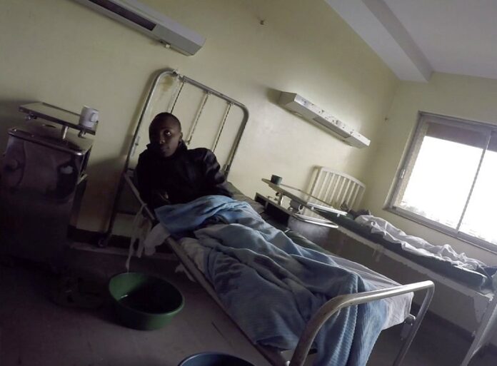Detained patients lie on beds in August in the Kenyatta National Hospital in Nairobi, Kenya. Photo: Desmond Tiro / Associated Press