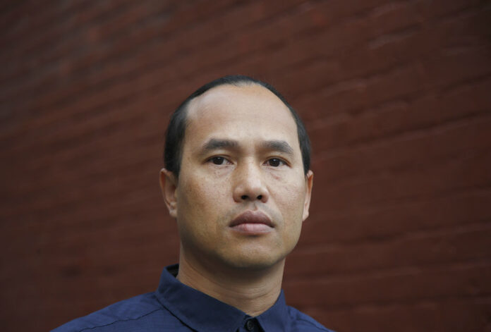 Borey Ai poses for a photo Tuesday outside of the Asian Americans Advancing Justice-Asian Law Caucus in San Francisco, California. Photo: Jeff Chiu / Associated Press