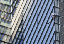 ‘French Spiderman’ Barred From Climbing UK Buildings People watch from inside the building as urban climber dubbed the French Spiderman, Alain Robert scales the outside of Heron Tower building in the City of London, Thursday, Oct. 25, 2018. Heron Tower is over 200 metres Photo: Frank Augstein / Associated Press