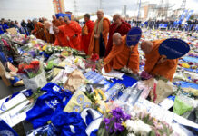Leicester to Return to Action Saturday After Death of Owner Buddhist Monks pay their respects at Leicester City soccer club Tuesday Oct. 30, 2018, after Leicester Chairman Vichai Srivaddhanaprabha, seen in poster, died along with four other people Saturday evening in a helicopter crash outside King Power Stadium. Photo: Mike Egerton / Associated Press