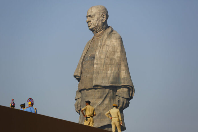 Indian policemen gather next to the Statue of Unity at Kevadiya colony Wednesday in Gujarat state, India. Photo: Ajit Solanki / Associated Press