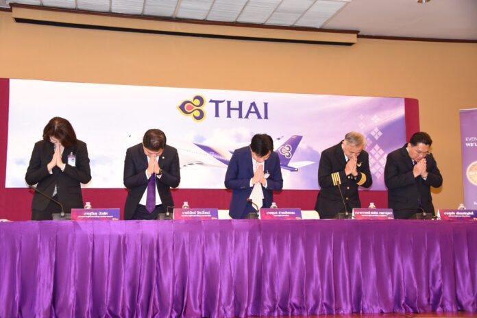 Thai Airways executives Monday apologize at a news briefing regarding the delay earlier this month of flight TG971, which was held up by a dispute over seating pilots in first class.