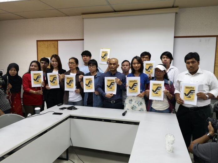 Activists on Tuesday pose during their meeting at Thammasat University.