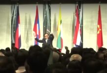 Thais React as Prayuth Tells Tokyo Forum to Stretch ‘Japanese Style’ In this image from video, Gen. Prayuth Chan-ocha leads a stretching session Wednesday at a forum in Tokyo, Japan. Image: Channel 3