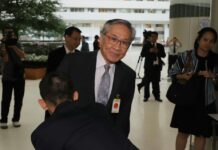Foreign Minister Don to Keep Job After Court Clears Wife Don Pramudwinai arrives Wednesday at the Constitutional Court in Bangkok.