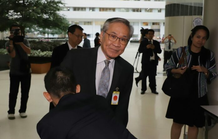 Don Pramudwinai arrives Wednesday at the Constitutional Court in Bangkok.