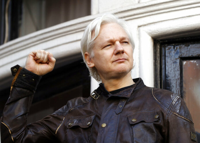 WikiLeaks founder Julian Assange greets supporters on May 19, 2017, outside the Ecuadorian embassy in London. Photo: Frank Augstein / Associated Press WikiLeaks founder Julian Assange greets supporters on May 19, 2017, outside the Ecuadorian embassy in London. Photo: Frank Augstein / Associated Press