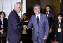 Japan Deepens Southeast Asian Ties With Airmen Program Singapore Defense Minister Ng Eng Hen greets Japan Defense Ministe Takeshi Iwaya at the ASEAN and Japanese Defense Ministers' Informal Meeting at the 12th ASEAN Defense Ministers' Meeting in Singapore on Saturday. Photo: Don Wong / Associated Press