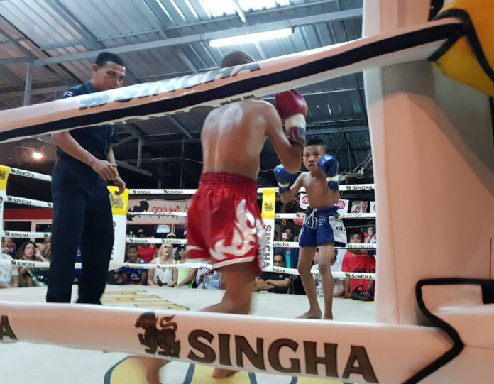 Young Muay Thai boxers fight for a crowd of tourists in April near Railay Beach in Krabi province.