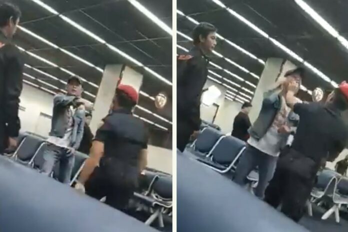 In this undated image from video, an airport security guard gets physical with a Chinese tourist. Image: Guide Complaint / Facebook In this undated image from video, an airport security guard gets physical with a Chinese tourist. Image: Guide Complaint / Facebook