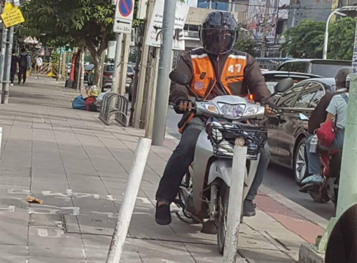 A motorcycle taxi on a sidewalk in Bangkok. Photo: Thailand Footpath / Facebook