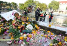 Light of Morning Dispels Romance of Loy Krathong Workers collect krathongs Friday morning from a pond inside Kasetsart University in Bangkok.
