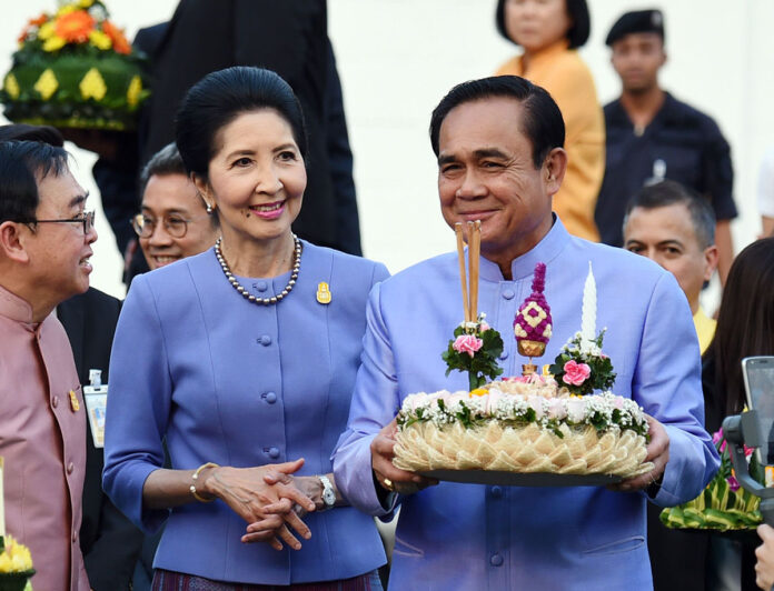 Naraporn Chan-ocha, left, and Gen. Prayuth Chan-ocha hold a krathong Thursday at Government House.