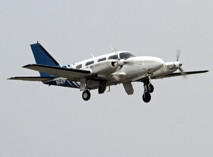 A Piper PA-31 Navajo, similar to the one used by Vortex Air, overflies Coventry Airport in 2015 in Coventry, England. Photo: Rob Hodgkins / Flickr