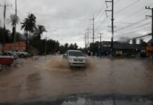 Massive Weekend Flooding Kills Toddler, Woman in Prachuap A truck drives through a flooded street Saturday in Bang Saphan district, Prachuap Khiri Khan province.
