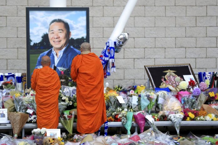 Buddhist Monks pay their respects Wednesday at at Leicester City Football Club in Leicester, England. Photo: Mike Egerton / Associated Press