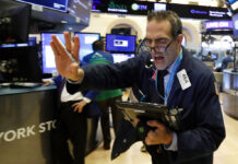 S&P 500 Slides Into ‘Correction’ for Second Time This Year Trader Gregory Rowe works Nov. 7 on the floor of the New York Stock Exchange. Photo: Richard Drew / Associated Press