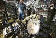 US, British War Dead Honored at Site Where Revolution Began Tim Wenrich, of Boston, caretaker at Old North Church, stands Wednesday near a bronze wreath, right, that is part of a memorial that honors fallen soldiers from the U.S. and Britain, on the grounds of the church in Boston, Massachusetts. Photo: Steven Senne / Associated Press