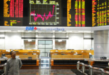 Asian Markets Trend Lower, Tracking Wall St Losses An investor walks in front of private stock trading boards in November at a private stock market gallery in Kuala Lumpur, Malaysia. Photo: Yam G-Jun / Associated Press
