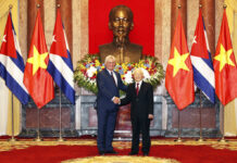 Vietnam and Cuba Sign Trade Agreement, Pledge to Deepen Ties Vietnamese President Nguyen Phu Trong, right, shakes hands Friday with his Cuban counterpart Miguel Diaz-Canel in in Hanoi, Vietnam. Photo: Tri Dung / Associated Press