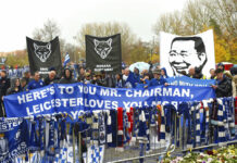 Leicester’s Farewell to Owner Who Delivered Footie Fairytale Fans on a memorial walk Saturday for those who lost their lives in the Leicester City helicopter crach including Leicester City Chairman Vichai Srivaddhanaprabha ahead of the Premier League match at the King Power Stadium, Leicester, England. Photo: Joe Giddens / Associated Press