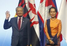Mahathir: China Should Define Claims in South China Sea Prime Minister Mahathir Mohamad of Malaysia and Myanmar Leader Aung San Suu Kyi, pose for a group photo during the opening ceremony for the 33rd ASEAN Summit and Related Summits Tuesday, Nov. 13, 2018, in Singapore. Photo: Bullit Marquez / Associated Press