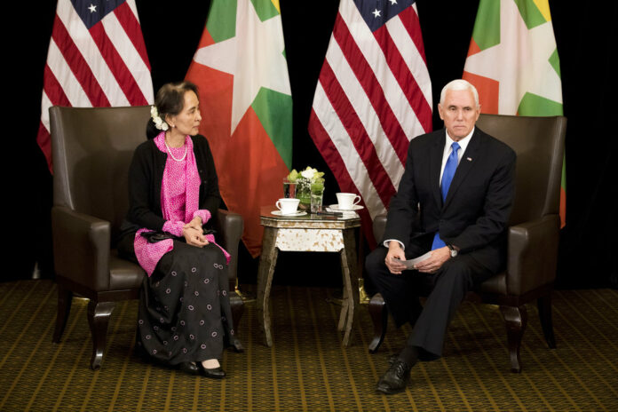 U.S. Vice President Mike Pence, right, meets Myanmar leader Aung San Suu Kyi on Wednesday in Singapore. Photo: Bernat Armangue / Associated Press