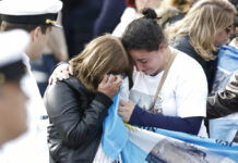 Argentine Submarine Missing a Year Found Deep in Atlantic: Officials Relatives of the missing crew of the ARA San Juan submarine, embrace in mourning after a ceremony remembering the one year anniversary of the disappearance of the submarine, at the Navy base in Mar del Plata, Argentina, Thursday, Nov. 15, 2018. Photo: Vicente Robles / Associated Press