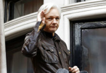 WikiLeaks’ Assange Faces Charges, Lawyer Says He’d Fight In this May 19, 2017, file photo, WikiLeaks founder Julian Assange greets supporters from a balcony of the Ecuadorian embassy in London. Photo: Frank Augstein / Associated Press