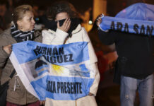 Argentina Minister Says Country Without Means to Rescue Sub Relatives of the crew of the ARA San Juan submarine embrace outside the navy base in Mar del Plata, Argentina, Saturday, Nov. 17, 2018. Photo: Federico Cosso / Associated Press