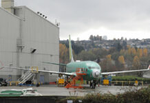 Boeing to Make Optional Safety Feature Standard on 737 Max Jets A Boeing 737-MAX 8 is parked Nov. 14 outside Boeing Co.'s 737 assembly facility in Renton, Washington. Photo: Ted S. Warren / Associated Press