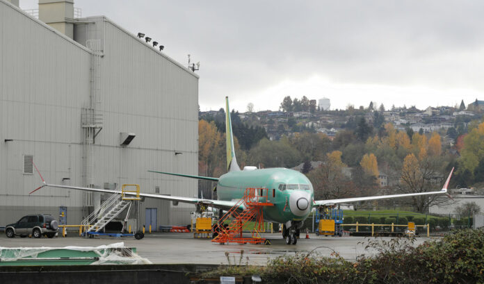 A Boeing 737-MAX 8 is parked Nov. 14 outside Boeing Co.'s 737 assembly facility in Renton, Washington. Photo: Ted S. Warren / Associated Press