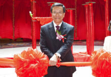 Malaysian Resort Company Sues Disney, Fox Over Theme Park Chairman of the Malaysian Genting Group developer Tan Sri Lim Kok Thay cuts a ceremonial ribbon to open a casino in Singapore. Photo: Joan Leong / Associated Press