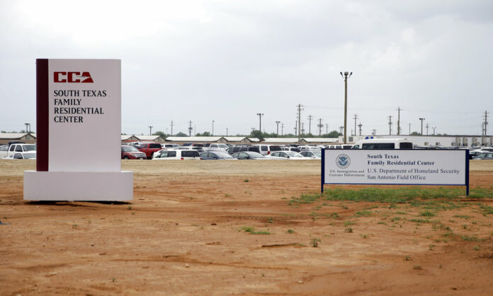 Signs are seen in 2015 at the entrance to the South Texas Family Residential Center in Dilley, Texas. Photo: Eric Gay / Associated Press