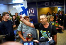 Finnish Christian Missionaries Held in Malaysia Return Home Spokesman and group leader Timo Valtonen, center, holds up a pen as he makes a statement to the press upon his Wednesday arrival, with three other Finns after being deported from Malaysia, at the airport in Vantaa, Finland. Photo: Associated Press