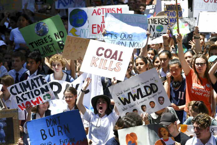 Thousands of students gather Friday during a rally demanding the government act on climate change, in Sydney. Photo: Associated Press