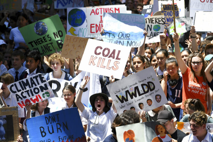 Thousands of students gather Friday during a rally demanding the government act on climate change, in Sydney. Photo: Associated Press Thousands of students gather Friday during a rally demanding the government act on climate change, in Sydney. Photo: Associated Press
