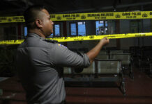 113 Inmates Escape Indonesian Prison During Prayer Time A police officer puts up police lines Thursday outside Lambaro Prison following a jailbreak in Aceh Besar, Indonesia. Photo: Hendri Abik / Associated Press