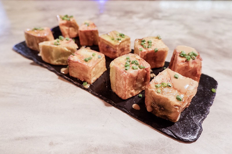 Eggplant cubes with honey and miso (180 baht).