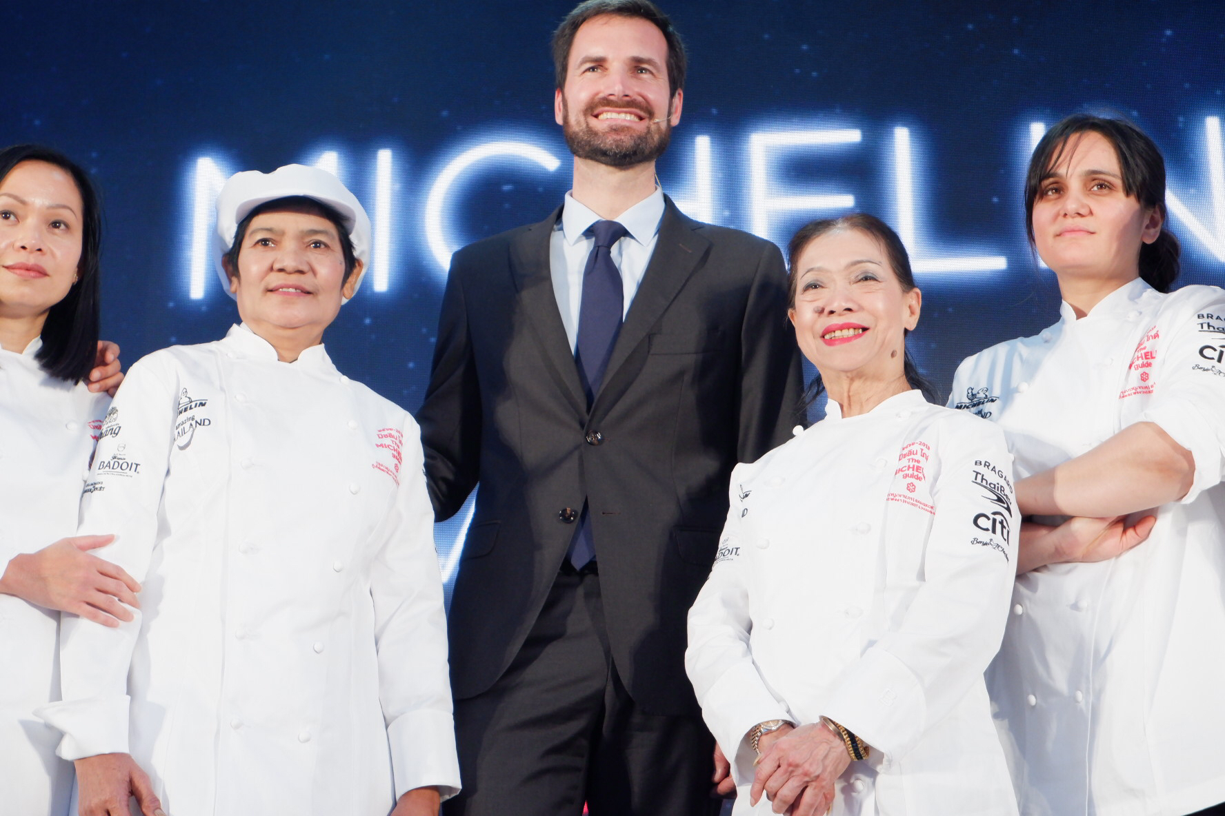 Female chefs who won a Michelin Star, including Banyen and Jay Fay, smile for the cameras Wednesday. 