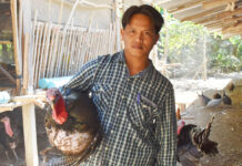 Isaan Turkey Farmer Talks About His Gobble Gobbles Kanisorn Mongkorn holds one of his turkeys.