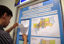 Parties Fume Over New ‘Gerrymandered’ Electoral Map Electoral district documents on display Oct. 4 at a press briefing by the Election Commission.