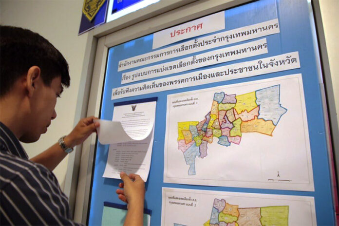 Electoral district documents on display Oct. 4 at a press briefing by the Election Commission.
