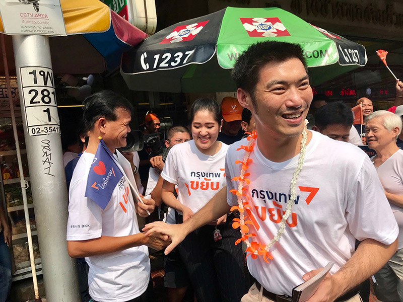 Future Forward Party spokeswoman Pannika Wanich, at center, with Thanathorn Juangroongruangkit, at right, Monday in Chinatown.