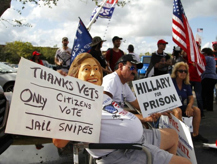 A crowd of protesters gathers Sunday outside the Broward County of Supervisor of Elections Office as a statewide election recount is underway. Photo: Carl Juste / Miami Herald via AP