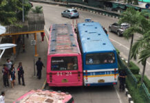 Transport Minister Open to Raising Some Bus Fares Next Year Two private buses block a street on Sep. 1 near CentralPlaza Lardprao in Bangkok. Photo: @KungBKP / Twitter
