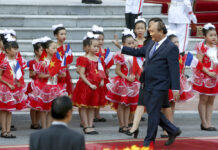 Vietnam Ratifies Pacific Rim Trade Pact Abandoned by Trump Vietnamese Prime Minister Nguyen Xuan Phuc waves to children on Nov. 2 outside the Presidential Palace in Hanoi. Photo: Minh Hoang / Pool photo via AP