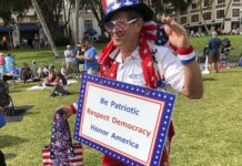 Anxious US Politicians and Volunteers Make Final Push Harvey Rosenfeld attends a Democratic party rally Saturday in West Palm Beach, Florida, bedecked in a red, white and blue outfit topped with an Uncle Sam hat and had a sign around his neck reading, “Be Patriotic, Respect Democracy, Honor America.” The 68-year-old retired publicist said he had been a Republican for 30 years until its stances against abortion rights and gay rights drove him away. Photo: Terry Spencer / Associated Press